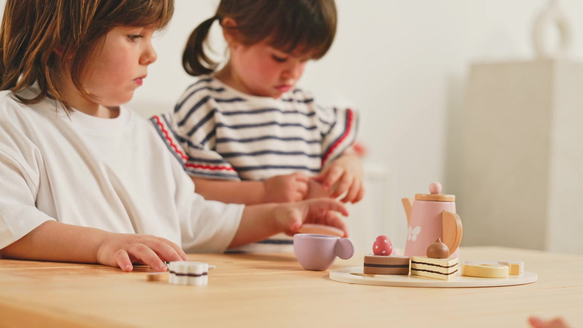 Children sharing a pretend tea party with a Nene Toys tea set
